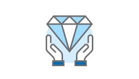 A pair of hands holding a diamond in their hands.