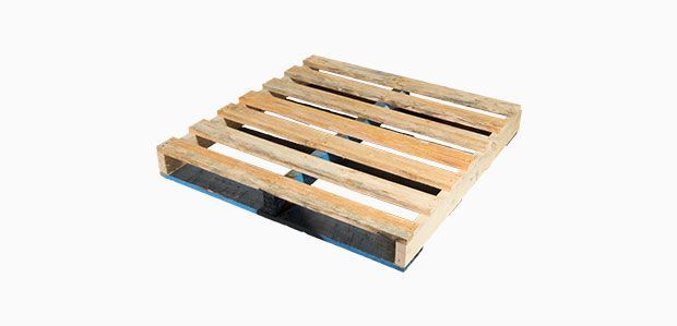 A wooden pallet is sitting on a white surface.