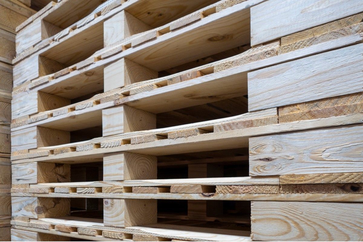 A stack of wooden pallets stacked on top of each other.