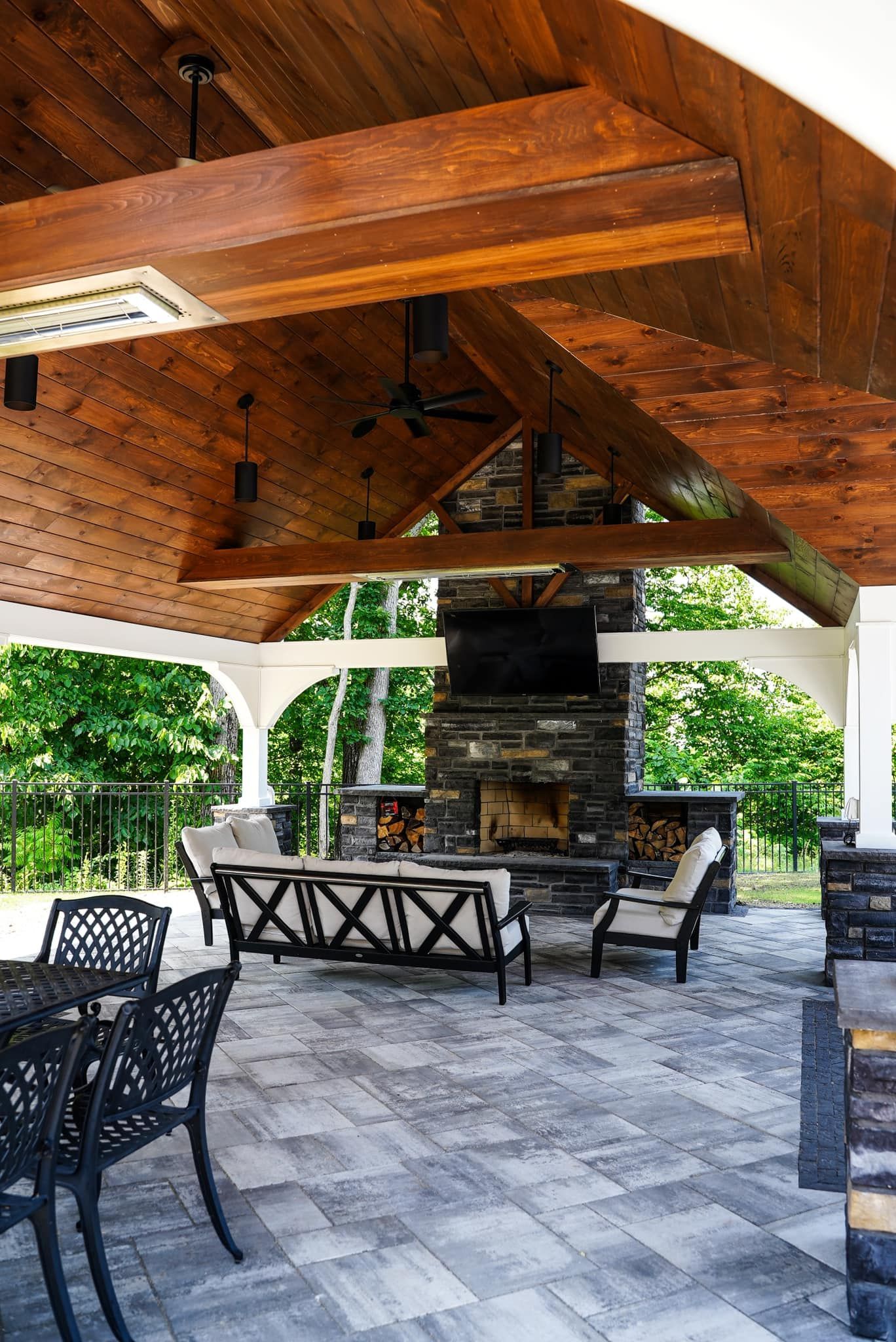 There is a fireplace in the middle of the patio.