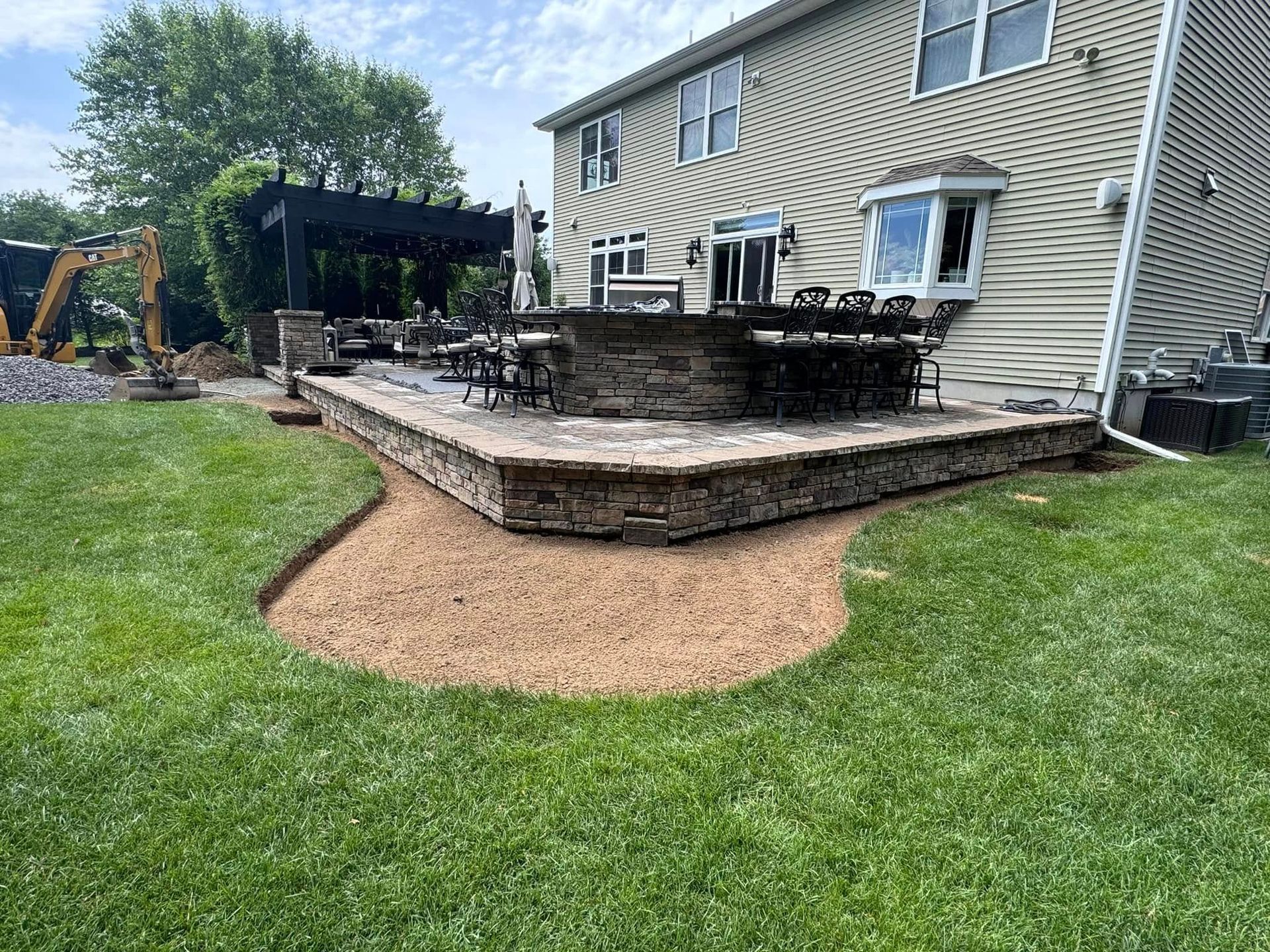 A large house with a large patio in front of it.