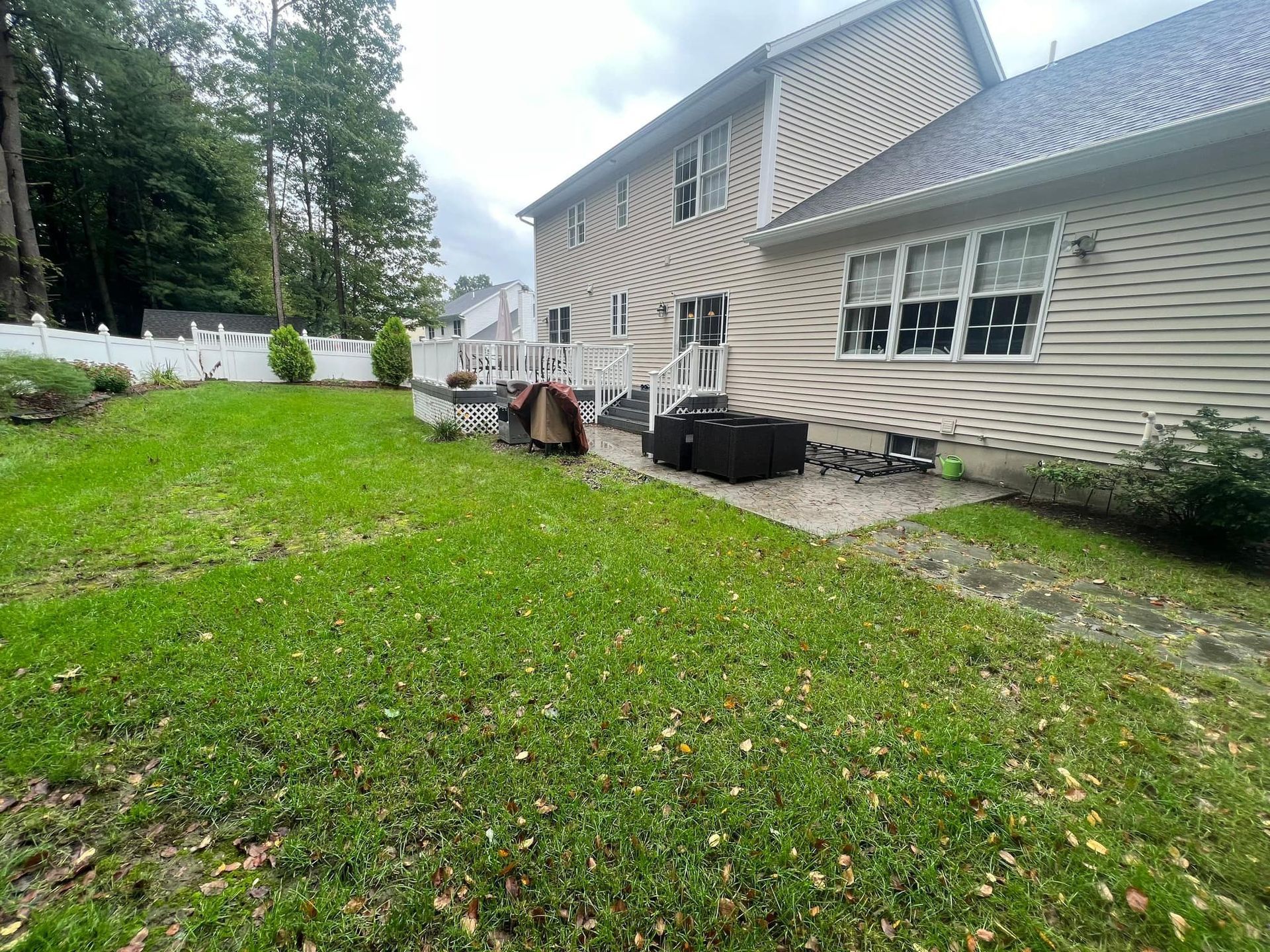 A large house with a large lawn in front of it.