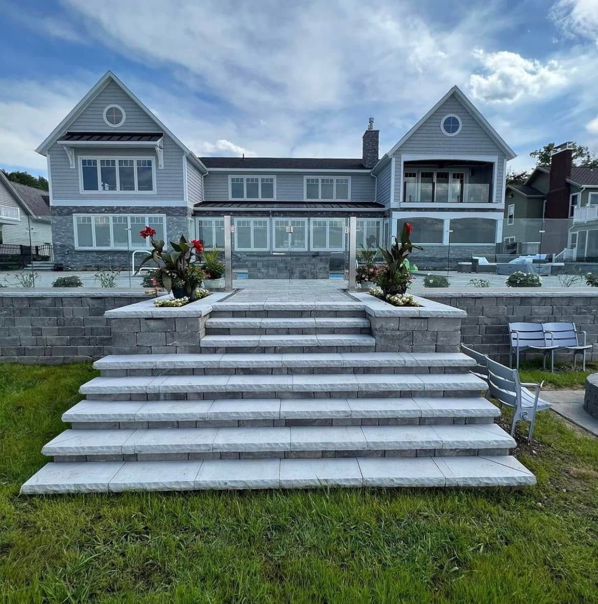 A large house with stairs leading up to it