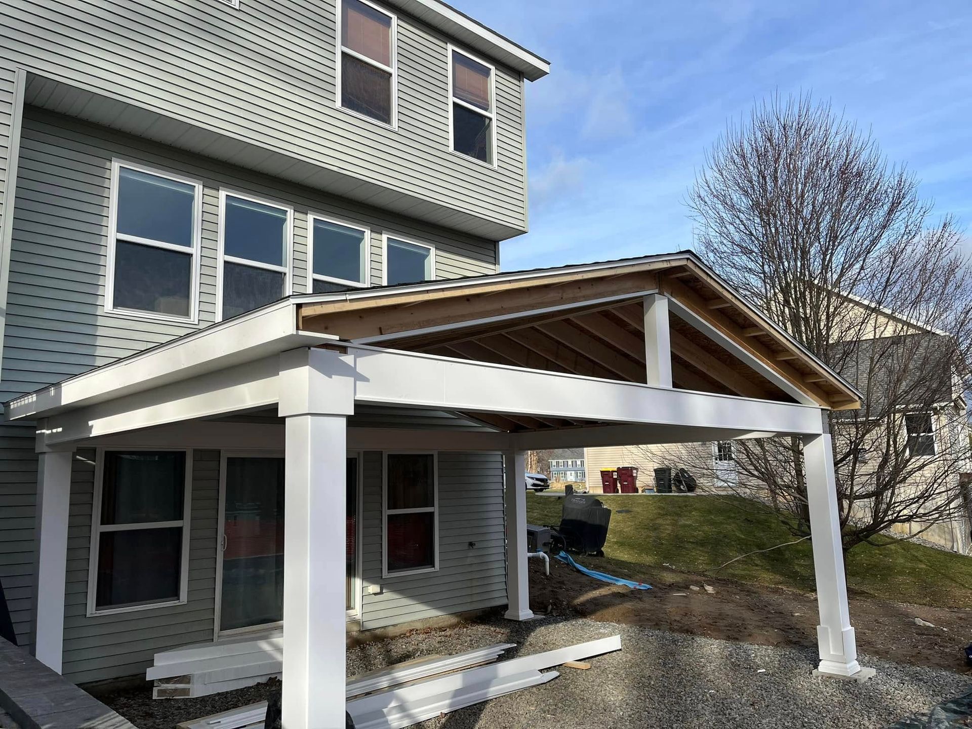 A house with a porch that is being built on top of it.