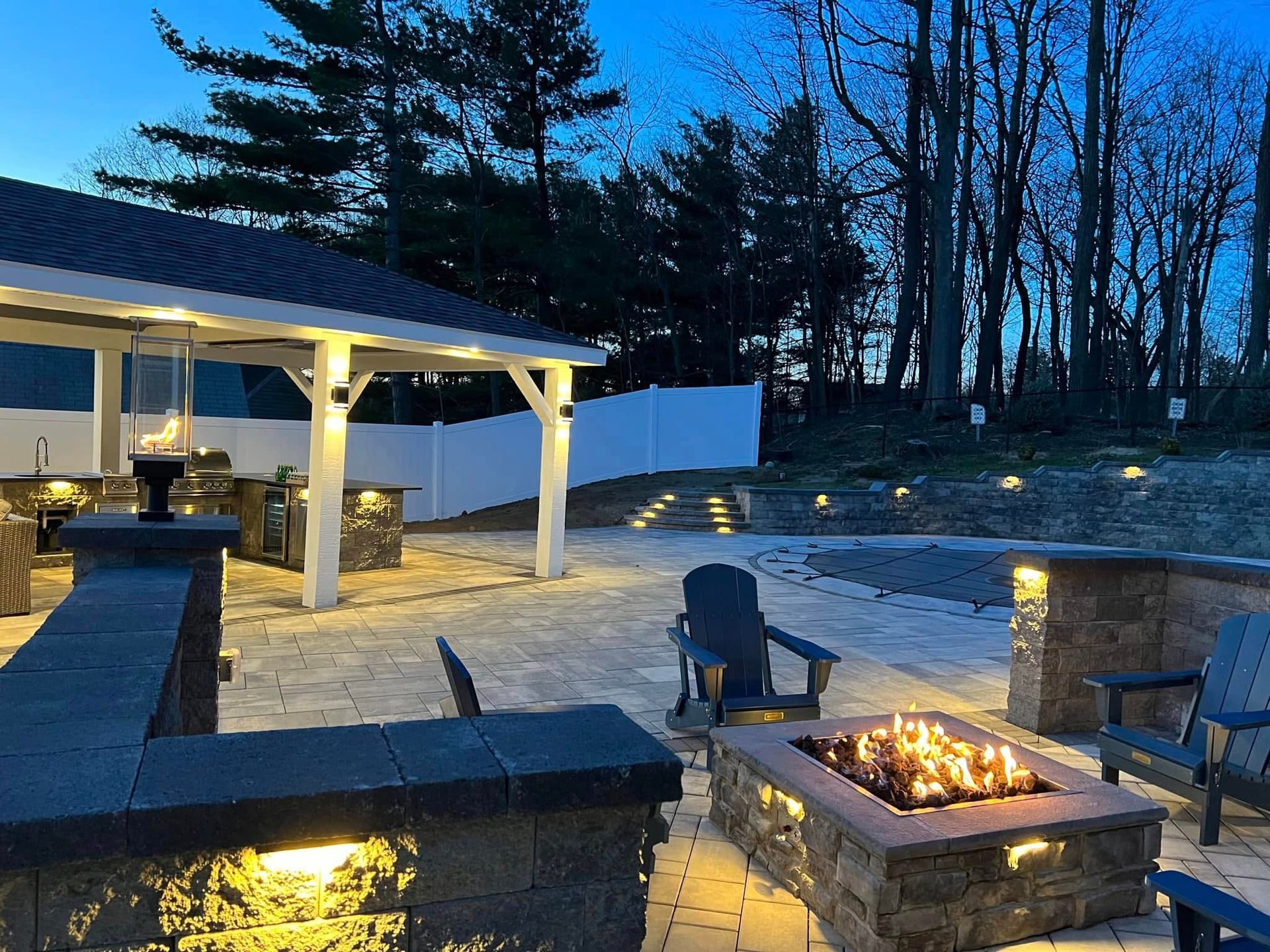 There is a fire pit in the middle of the patio.