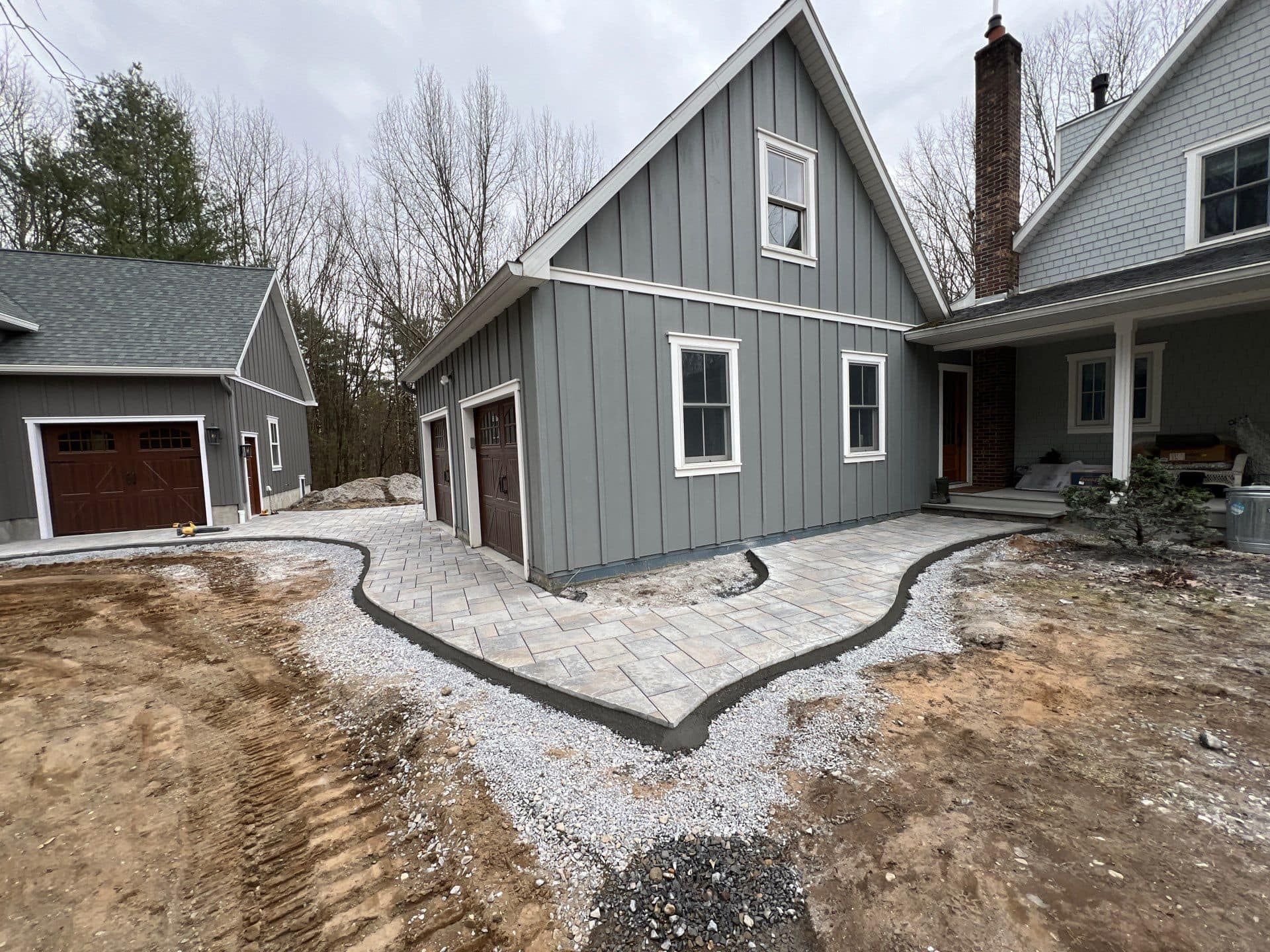 A house is being built in the middle of a dirt field.