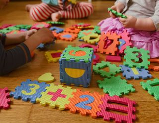Childcare — Child Playing Puzzle Toys in Mentor, OH