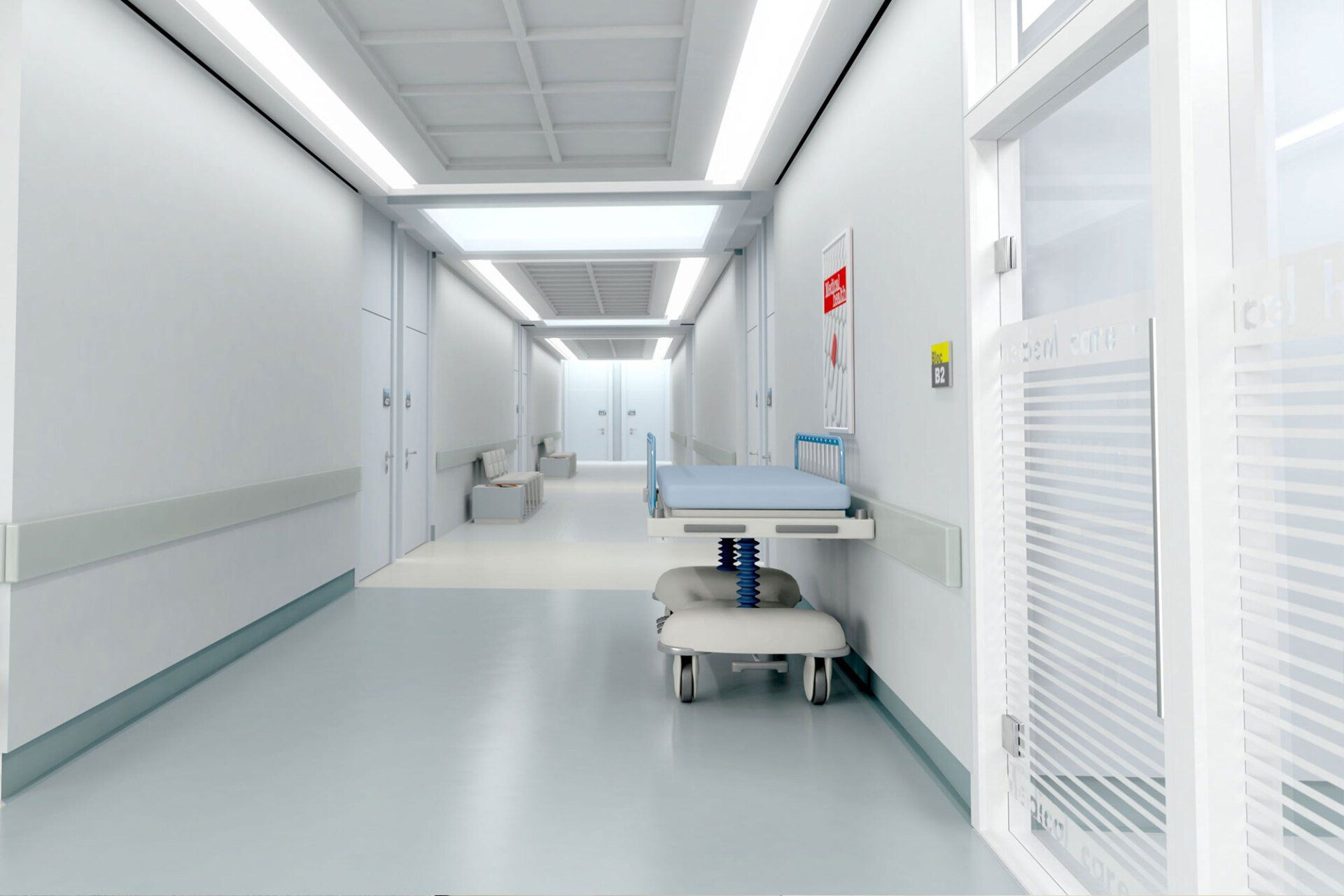 A hospital hallway with a bed in the middle of it.