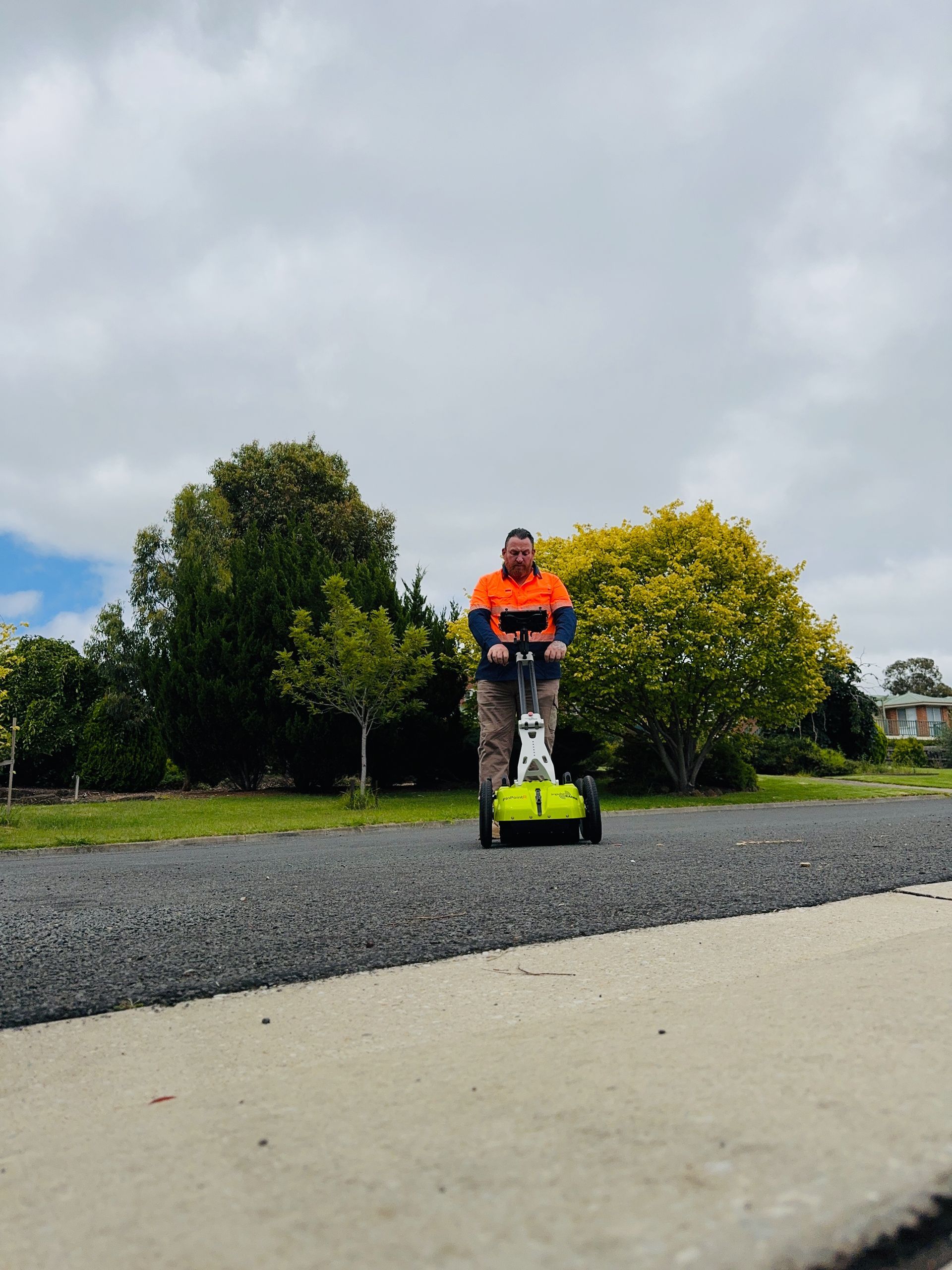 Image depicts Warren Eeles from Pulse Underground Location Services, using Ground Penetrating Radar 