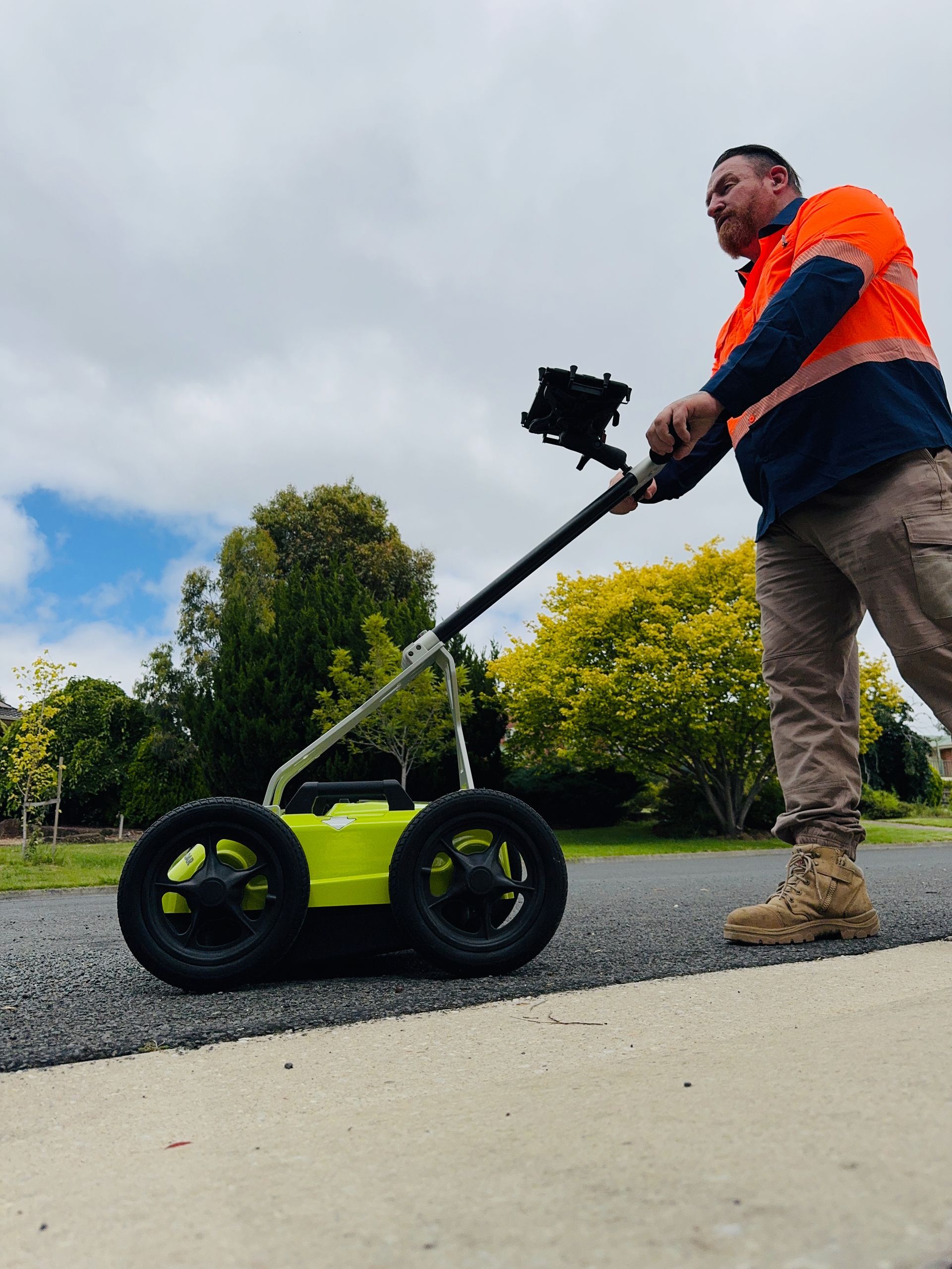 Image depicts a utility locator pushing GPR.