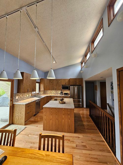 A kitchen with a large island in the middle of it