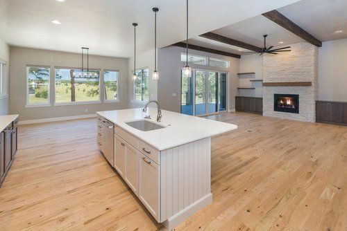 There is a large island in the middle of the kitchen.