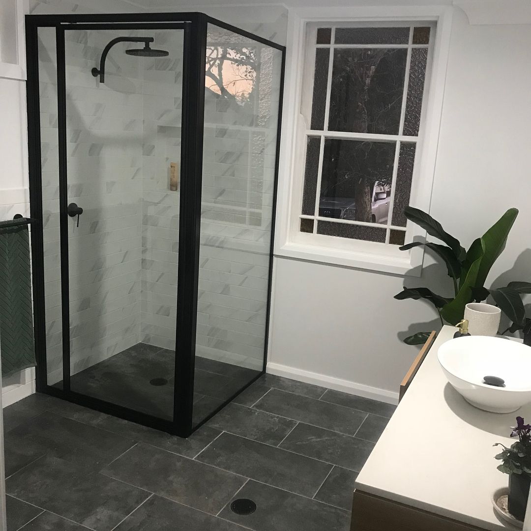 A Bathroom With a Shower, Sink, and Window — Swift Glass & Aluminium In Coffs Harbour, NSW