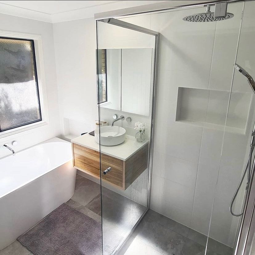 A Bathroom With a Sink, Tub, Shower and Mirror — Swift Glass & Aluminium In Woolgoolga, NSW
