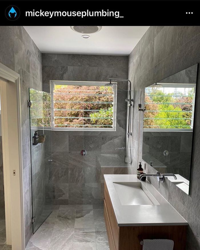 A Bathroom With a Sink, Shower, Mirror and Window — Swift Glass & Aluminium In Woolgoolga, NSW