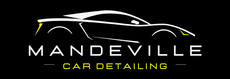 A logo for mandeville car detailing  with a yellow car on it.