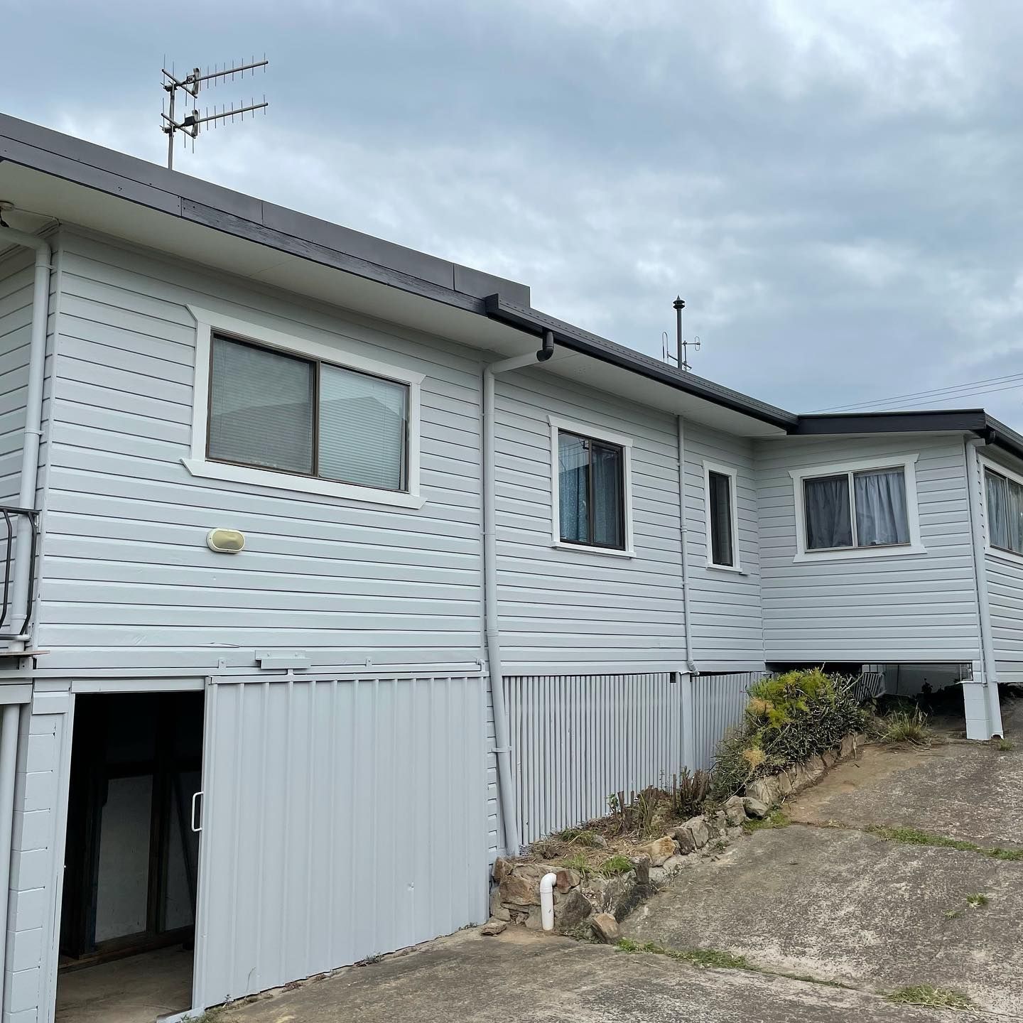 A Light Gray House With Matching Siding and Trim, Gray Roof — All Coast Painting in Tweed Heads South, NSW