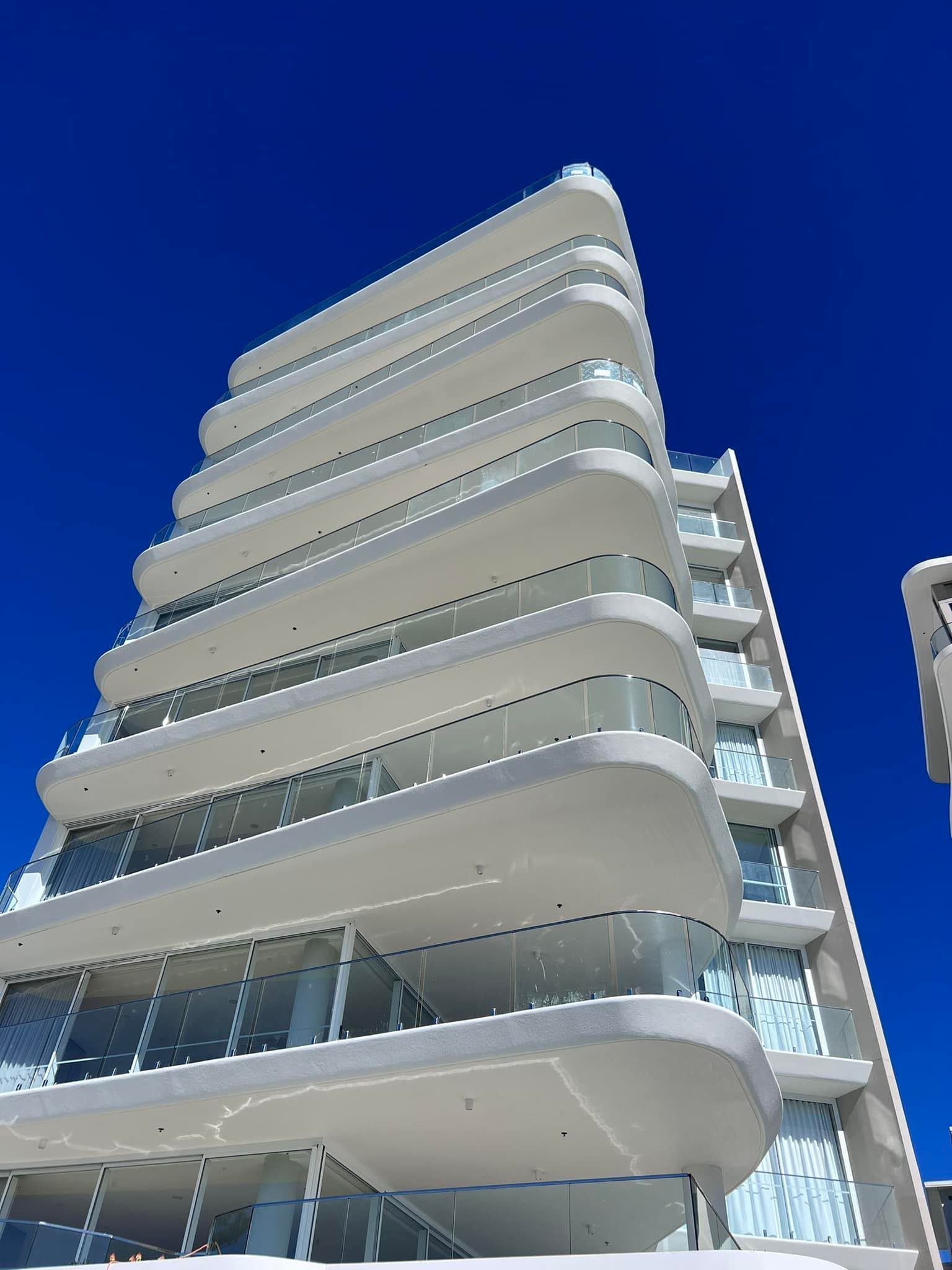 Commercial Wooden Deck With Glass Railing, White Columns — All Coast Painting in Tweed Heads South, NSW