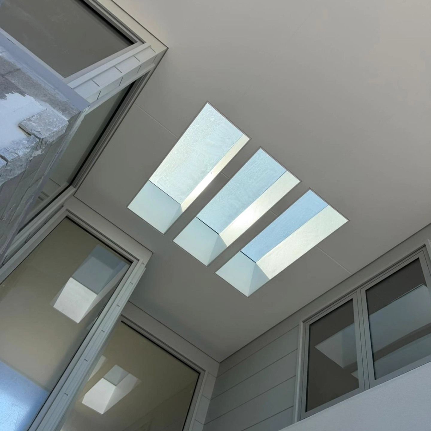 Skylights in a White Ceiling Above Windows in an Interior Space — All Coast Painting in Tweed Heads South, NSW