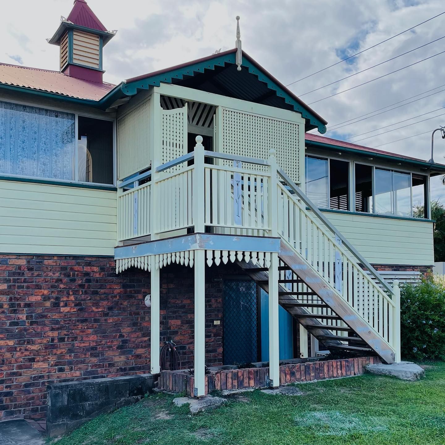 Two-story House With Light Green Siding and Brick Base — All Coast Painting in Tweed Heads South, NSW