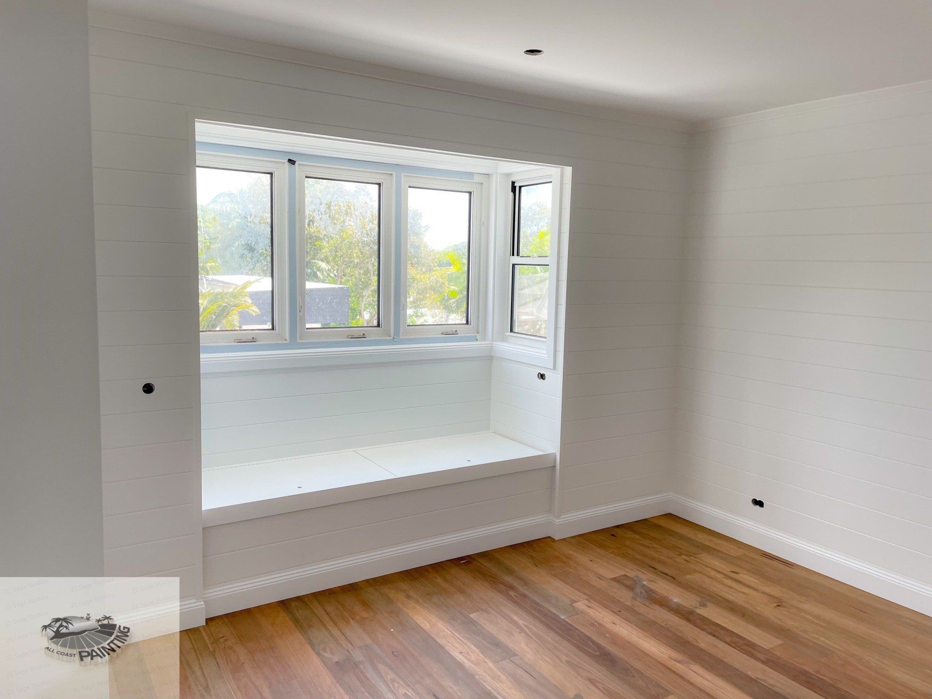 Empty Room With White Walls, a Window Seat, and Wooden Floor — All Coast Painting in Tweed Heads South, NSW