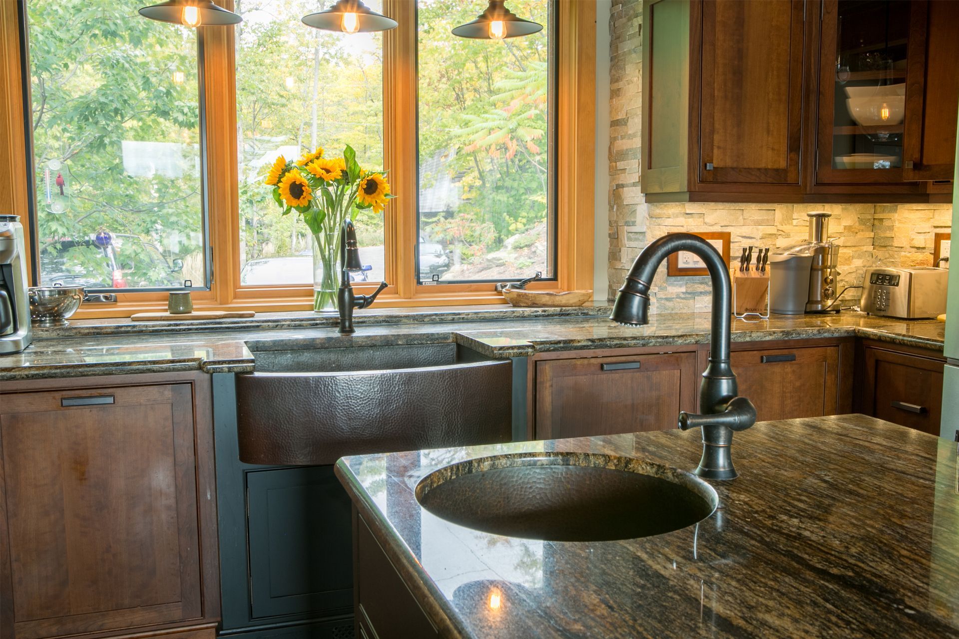 Classic Muskoka kitchen showing hammered copper sinks.