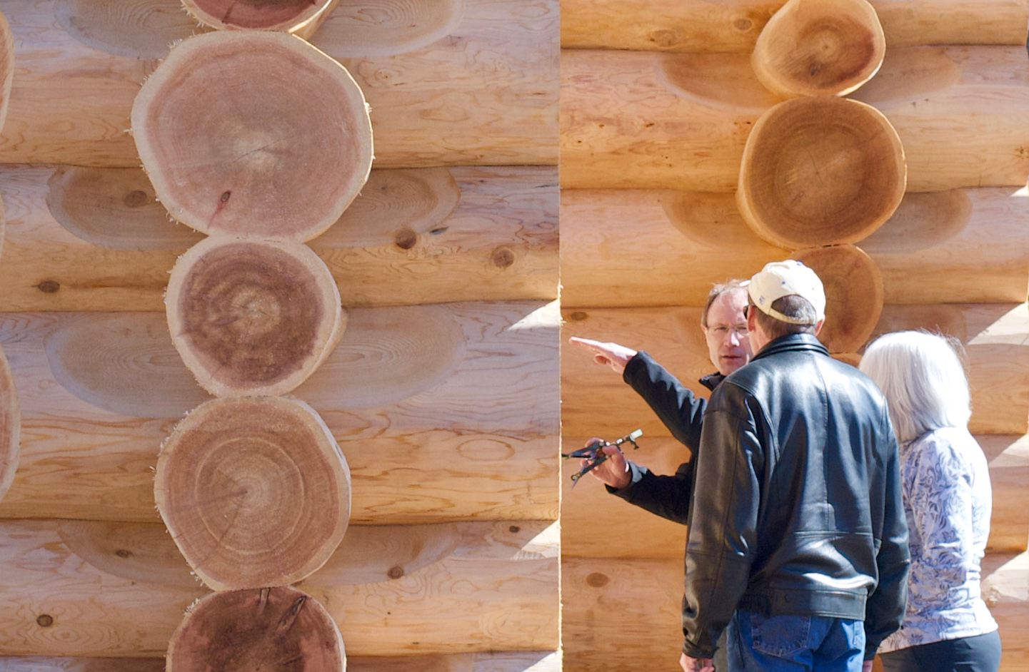 CedarCoast Partner, Patrick Bongers explains log cottage construction with prospective customers.