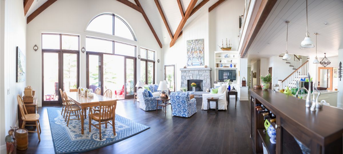 Custom Muskoka Cottage featuring a 
 large living room filled with furniture and a fireplace.
