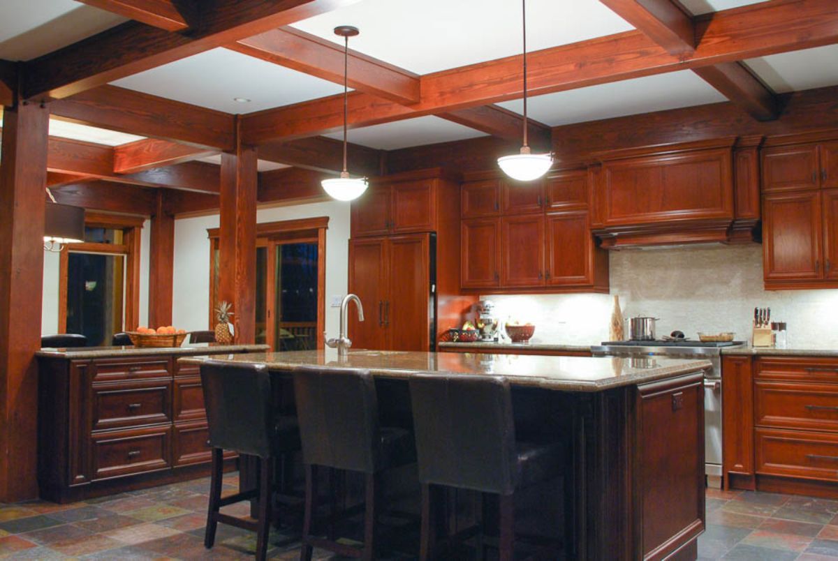 Custom Muskoka Cottage featuring a  kitchen with wooden cabinets and a large island