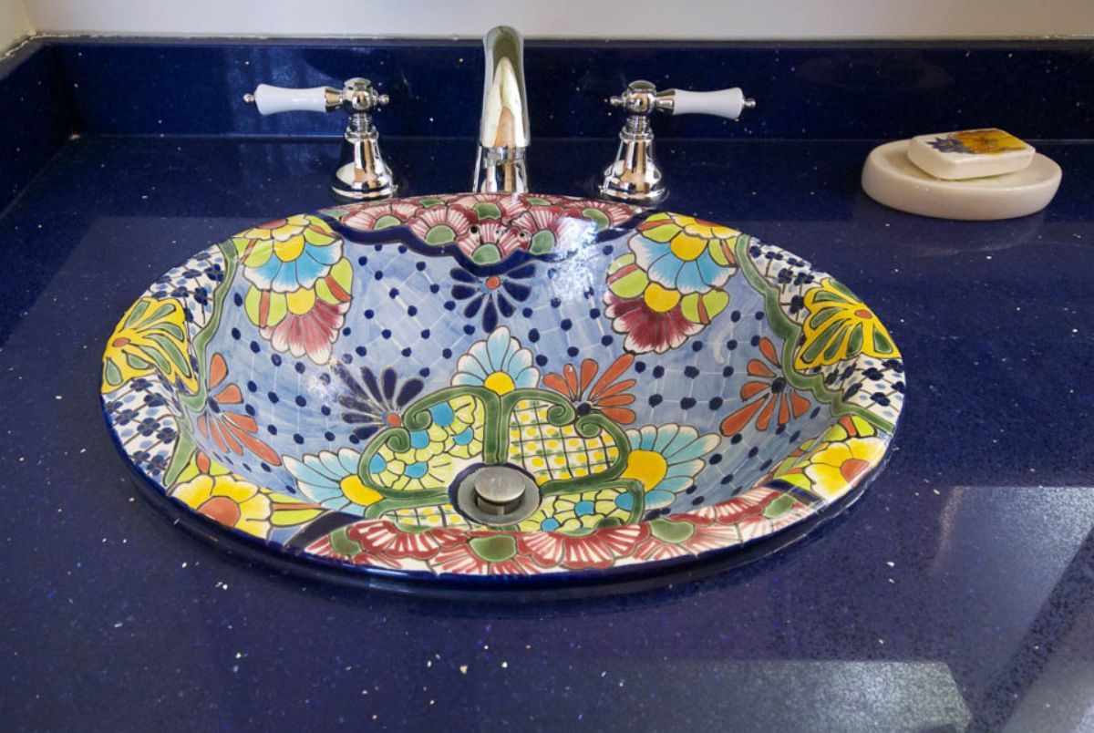 Custom Muskoka Cottage featuring a  colorful sink sits on a blue counter top