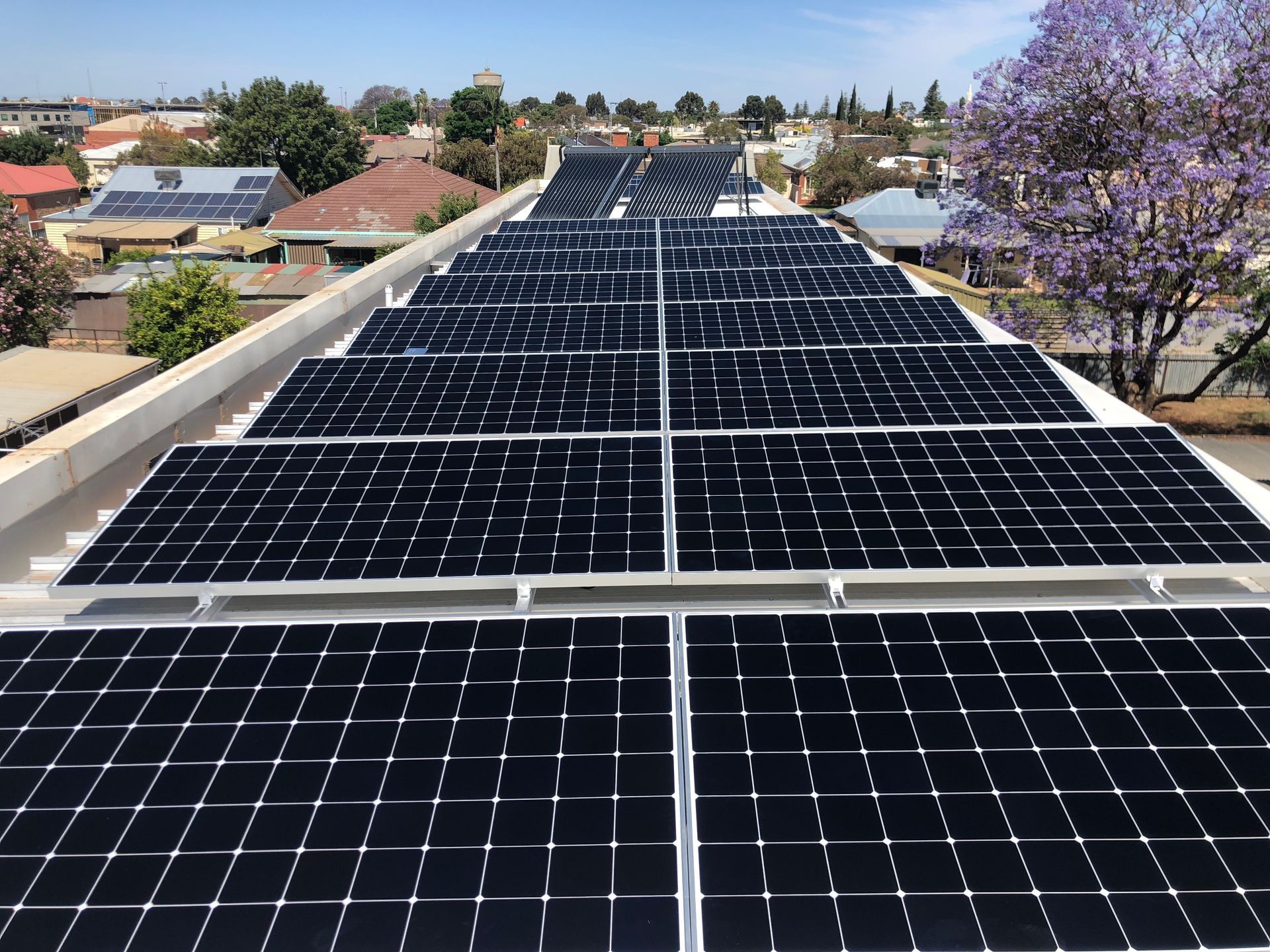 Two Men Are Installing Solar Panels on The Roof of A House | Mildura, VIC | Mildura Solar