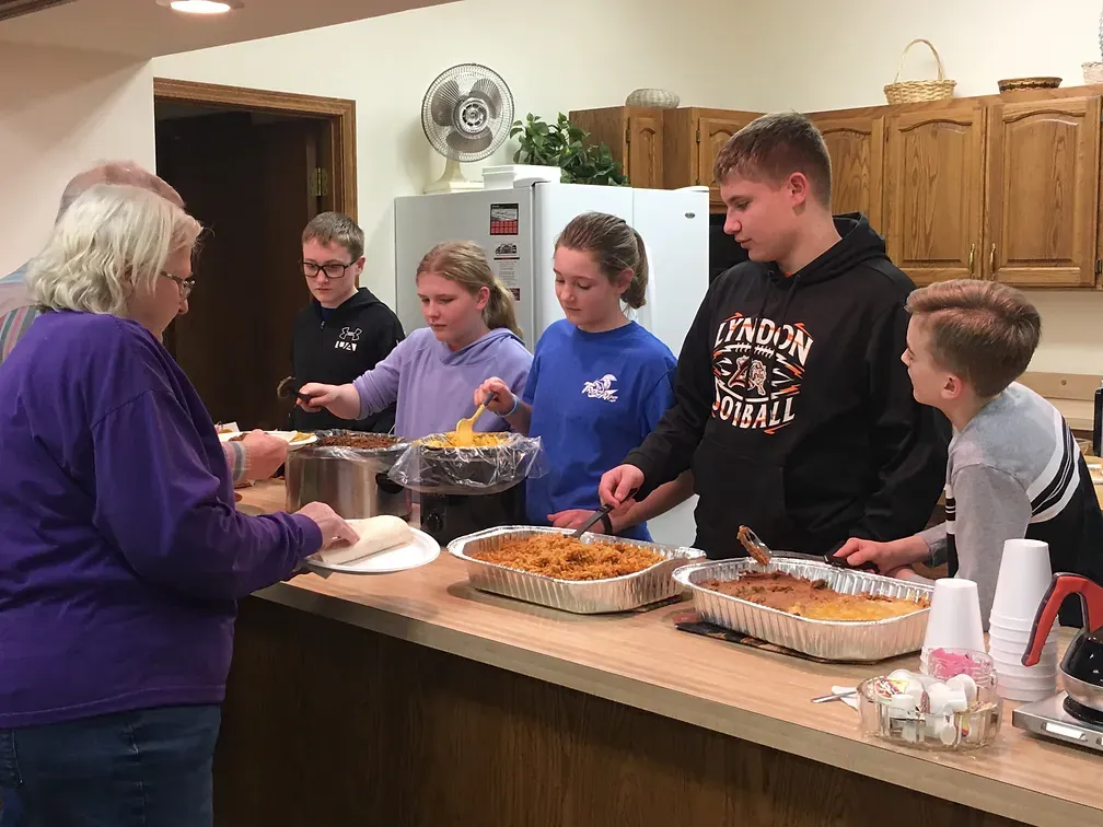 Zion Lutheran Church - Vassar, KS - Youth Serving Meal