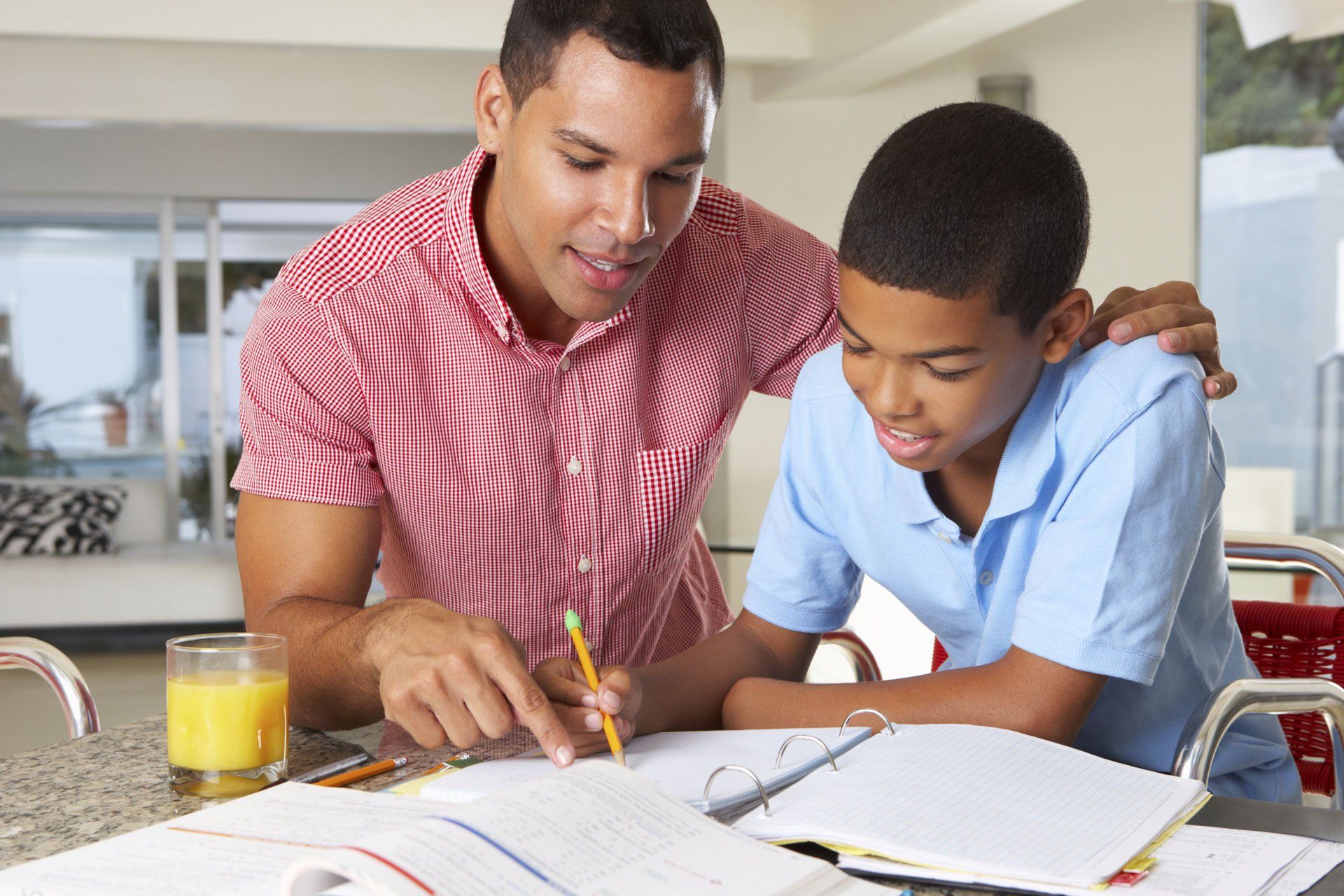 Father helping his son with homework