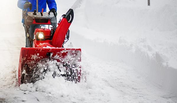 Worker Using Snow Blower | Springfield, MA | Thomas P. Ryland Co.