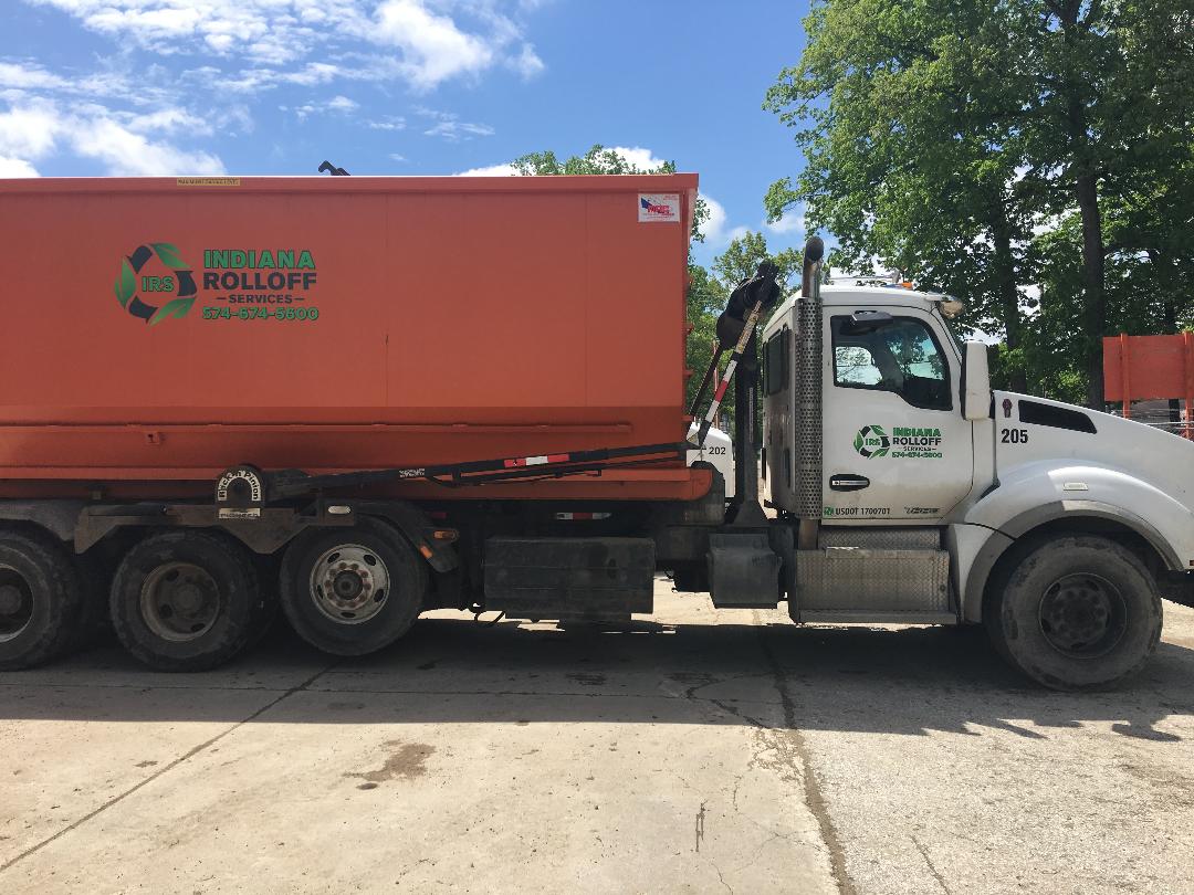A truck carrying a dumpster rental in Elkhart, IN