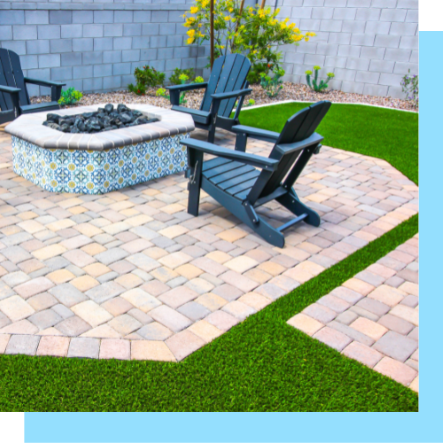 Two chairs are sitting on a patio next to a fire pit.