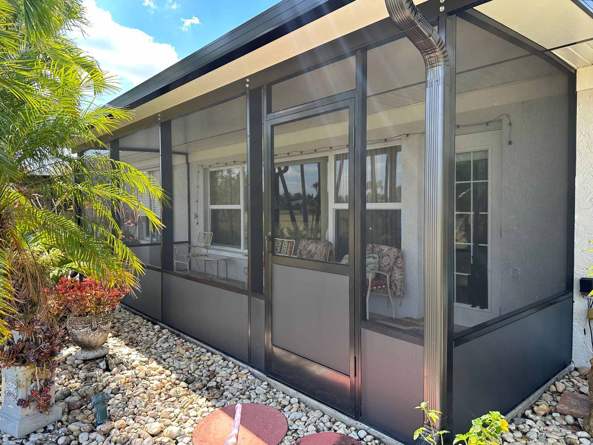 A screened room in front of home