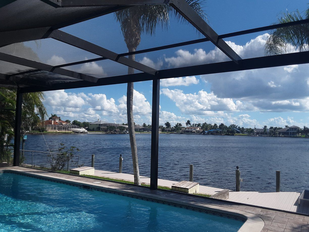 A swimming pool with a view of a lake