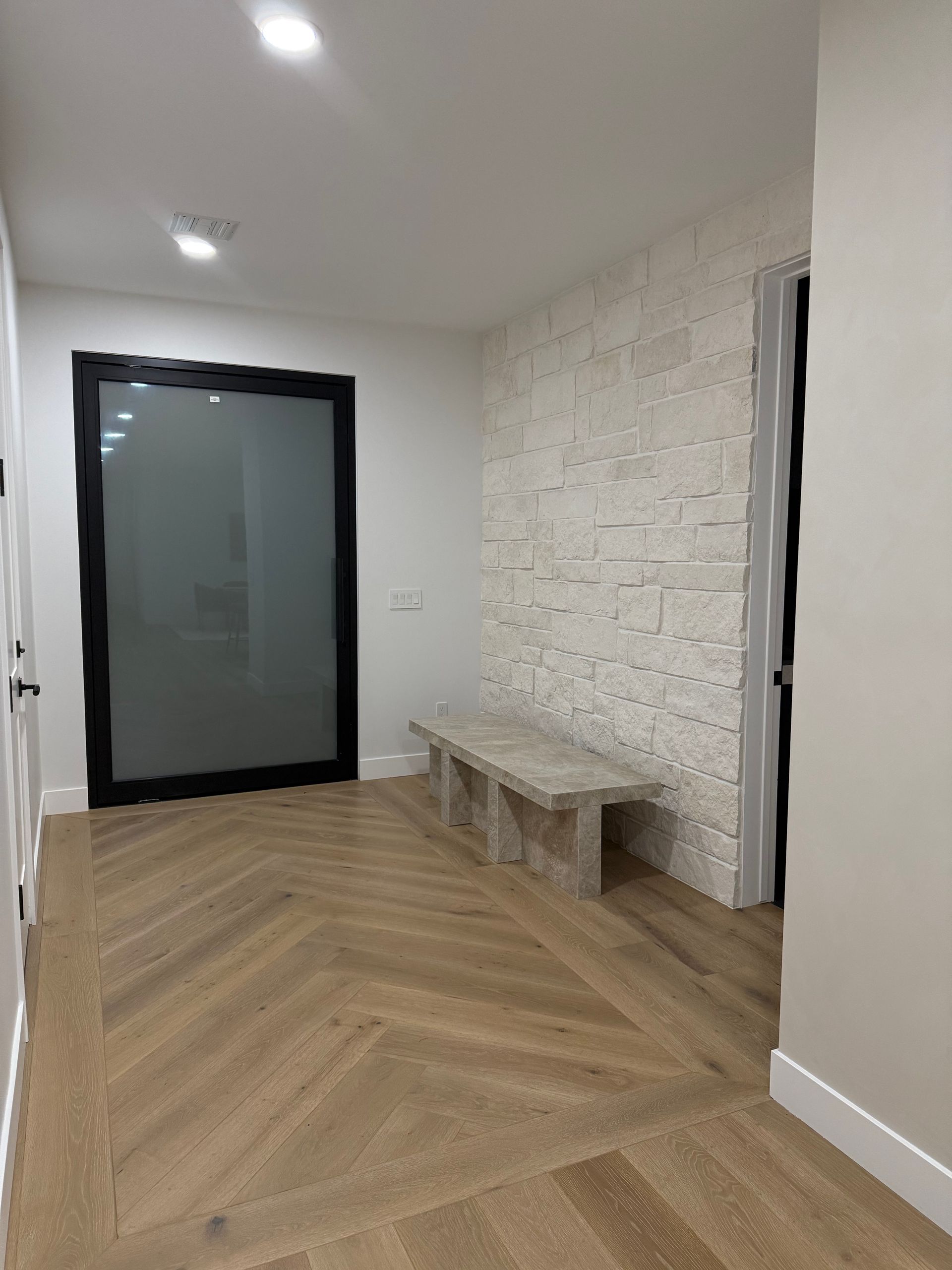 A bathroom with two sinks and a walk in shower.