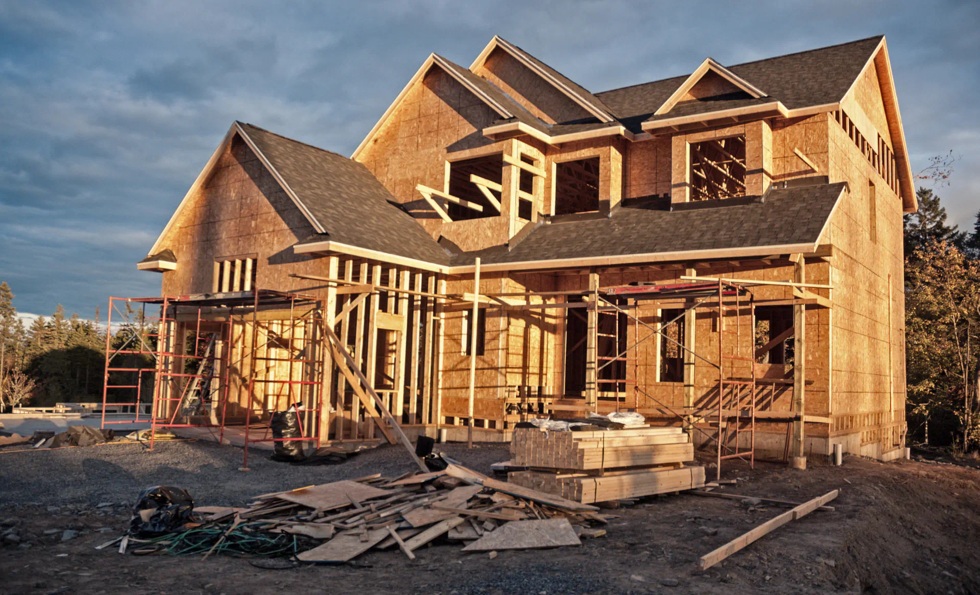 A large house is being built with a lot of scaffolding around it