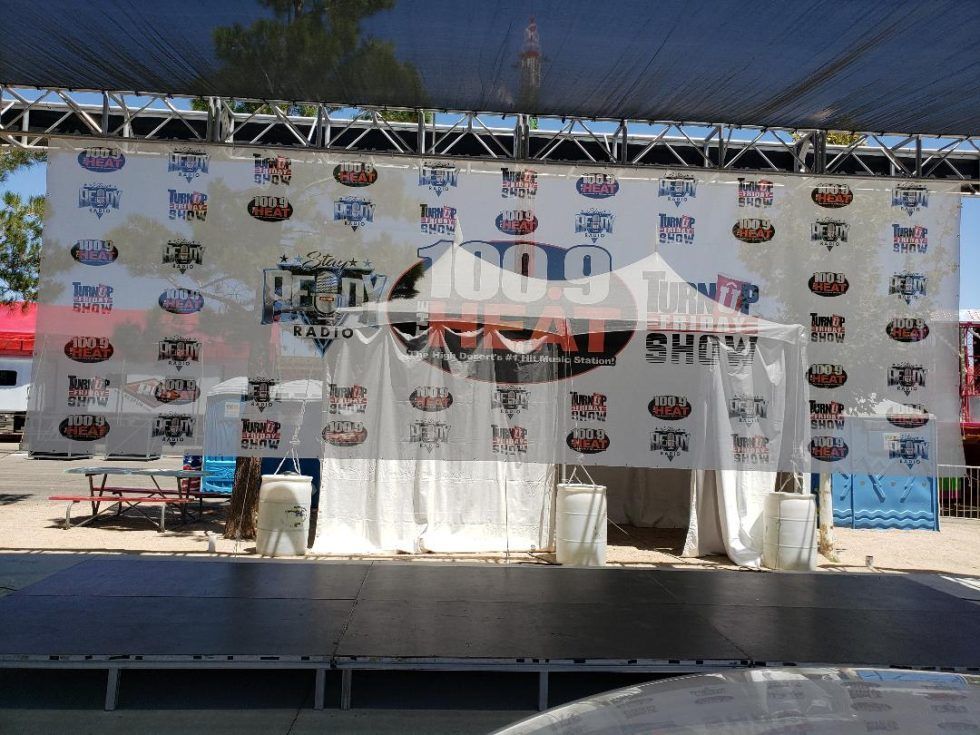 A stage with a banner behind it that says ' show ' on it