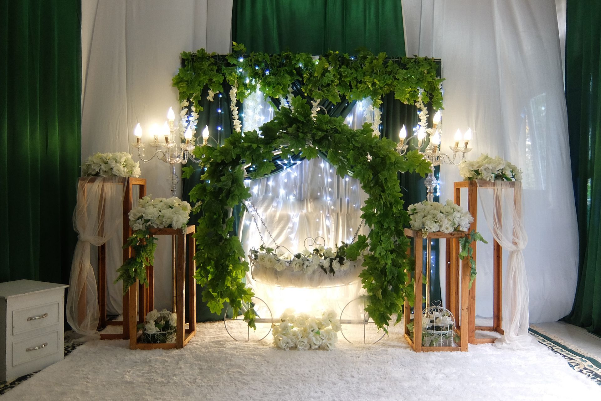 A room decorated with flowers and candles for a wedding.