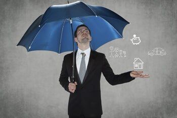 businessman with an umbrella - Insurance in Manassas, VA
