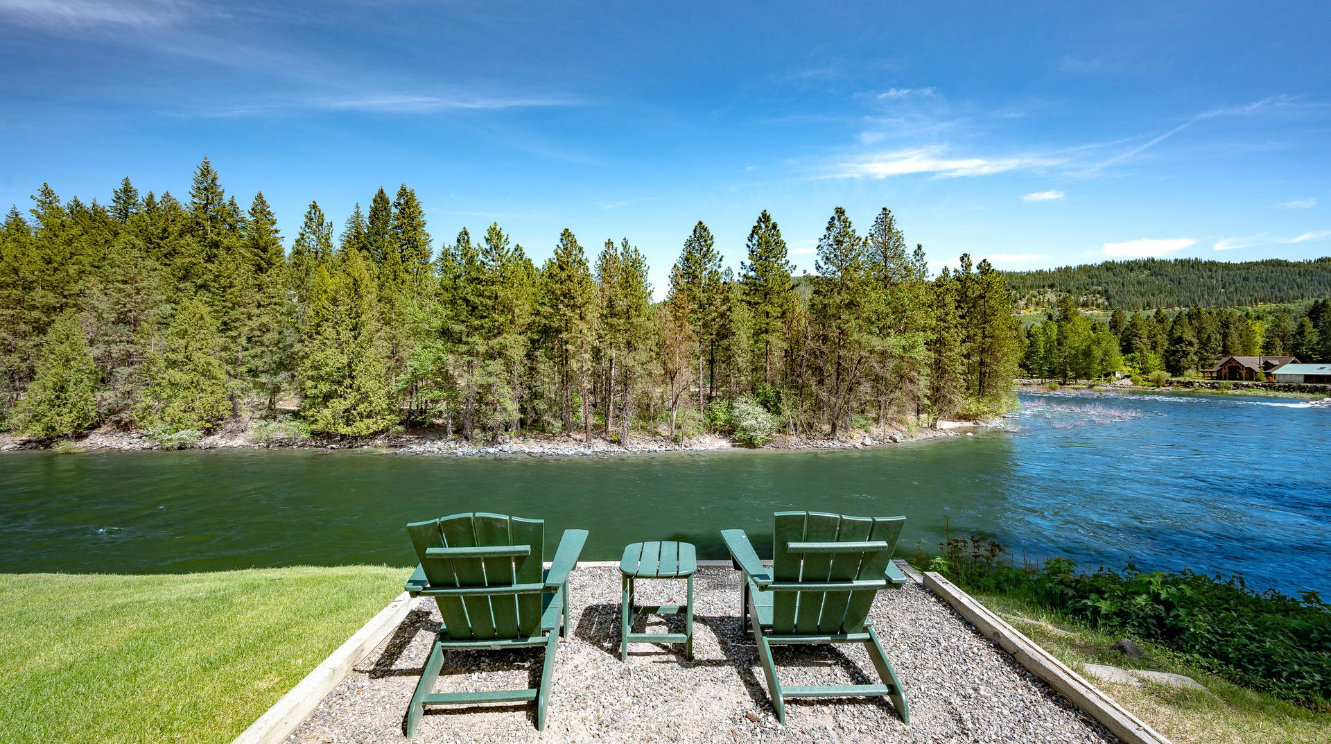 People gathered around a rustic wooden table with cups of tea, oatmeal bowls, passion fruit, and a book.