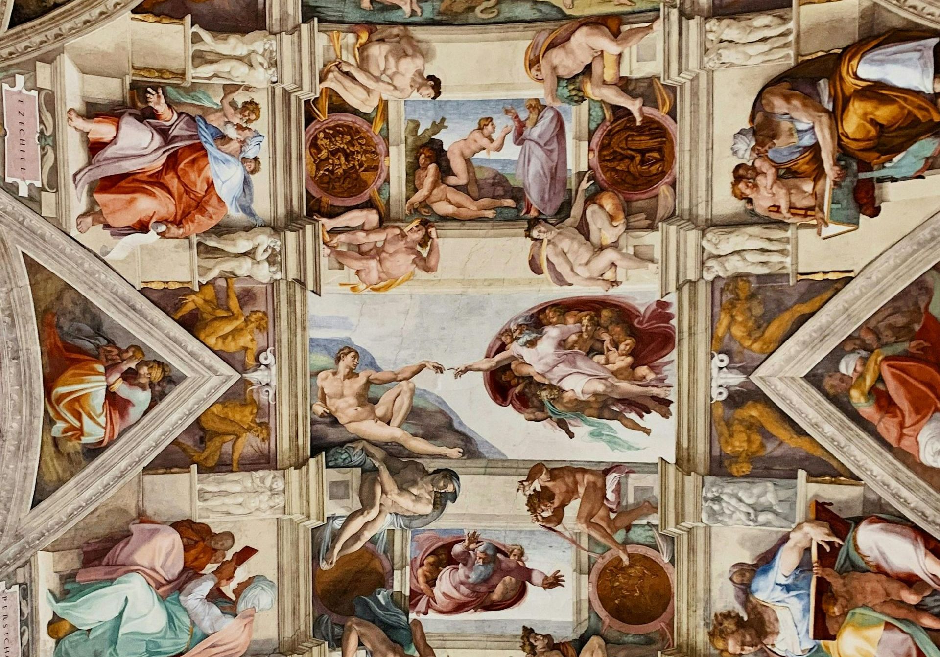 The Sistine Chapel ceiling fresco painted by Michelangelo, featuring scenes from the Bible including 'The Creation of Adam.