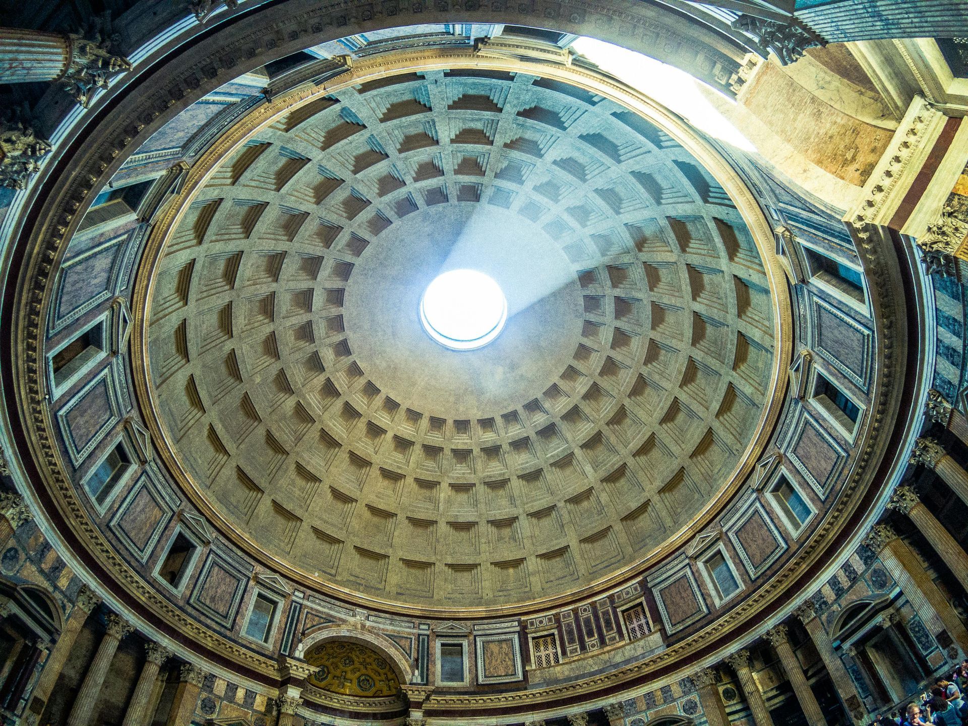 Interior of the Pantheon in Rome, showcasing the massive concrete dome with an open oculus