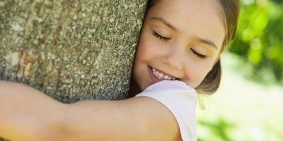 Girl Hugging a Tree - Pest Control in Dover, NH