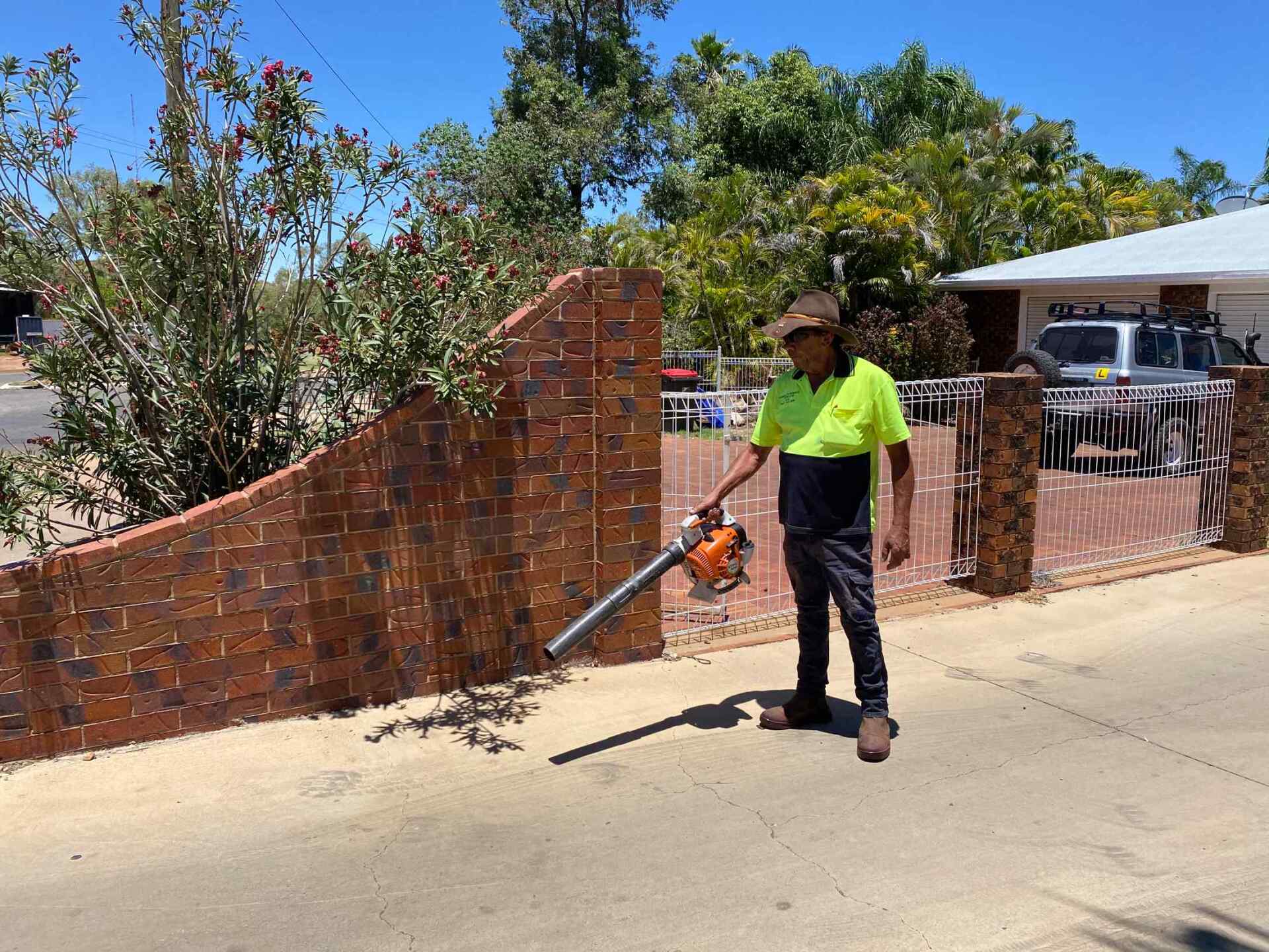 Man Using Vacuum Out Side 3 — Gallery in Mount Isa, QLD