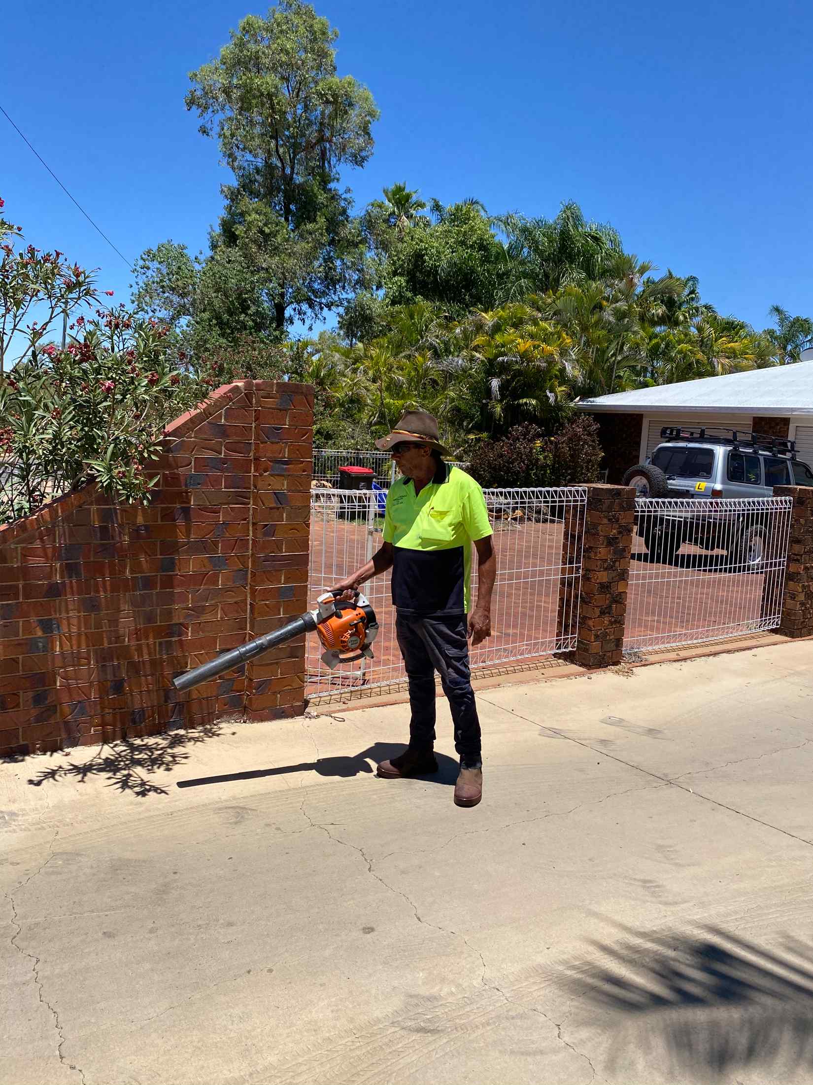 Man Using Vacuum Out Side 4 — Gallery in Mount Isa, QLD