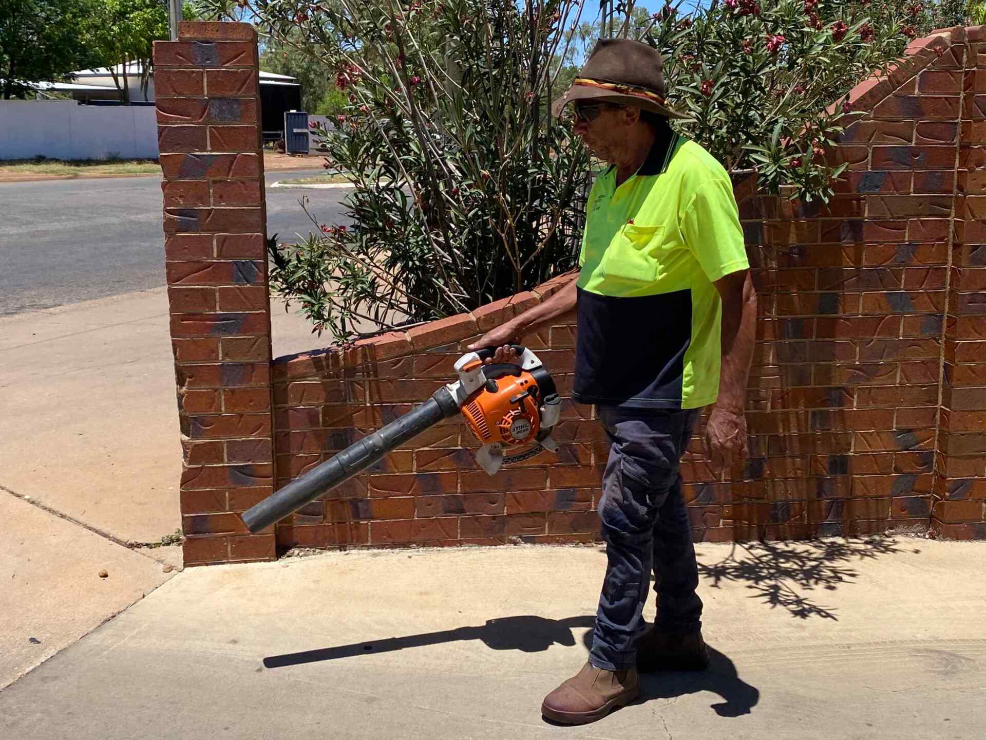 Man Using Vacuum Out Side — Gallery in Mount Isa, QLD